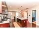 Updated kitchen featuring stainless steel appliances, granite counters, and an island with seating at 319 S Randolph St, Indianapolis, IN 46201