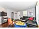 Bright living room featuring hardwood floors, decorative artwork, and comfortable seating at 319 S Randolph St, Indianapolis, IN 46201