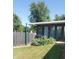 Exterior view of a structure with a wood fence and lush green vegetation at 3348 W 800 N, Fairland, IN 46126