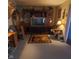 Cozy living room featuring a large entertainment center and decorative rug at 3348 W 800 N, Fairland, IN 46126