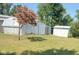 Exterior view of multiple white sheds on a well maintained grassy lot at 3348 W 800 N, Fairland, IN 46126