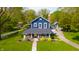 Beautifully maintained two-story home with lush landscaping, long driveway, and charming guest house at 3405 W 8Th Street Rd, Anderson, IN 46011