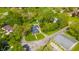 An aerial view of a home with mature trees and a detached garage at 3405 W 8Th Street Rd, Anderson, IN 46011