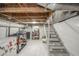 Finished basement with plastic lining, stairs, and open storage space at 3405 W 8Th Street Rd, Anderson, IN 46011