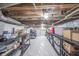 Clean basement featuring plastic lining, storage shelves, and easy organization at 3405 W 8Th Street Rd, Anderson, IN 46011