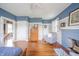 Spacious bedroom featuring a fireplace, wood floors, and ample natural light at 3405 W 8Th Street Rd, Anderson, IN 46011