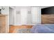 Bedroom featuring a comfortable bed, hardwood floors, a modern TV, and relaxing natural light at 3405 W 8Th Street Rd, Anderson, IN 46011