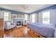 Bright bedroom features hardwood floors, a fireplace, and natural lighting at 3405 W 8Th Street Rd, Anderson, IN 46011