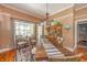 Charming dining room features a rustic wooden table, decorative hutch, and bright natural lighting at 3405 W 8Th Street Rd, Anderson, IN 46011