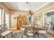 Charming dining room features a rustic wooden table, decorative hutch, and bright natural lighting at 3405 W 8Th Street Rd, Anderson, IN 46011