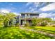 Charming two-story home with a manicured lawn and cozy front porch at 3405 W 8Th Street Rd, Anderson, IN 46011