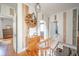 Hallway featuring hardwood floors, decorative accents, and natural lighting at 3405 W 8Th Street Rd, Anderson, IN 46011