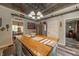 Bright kitchen boasts an island with butcher block countertop, unique décor, and stainless steel appliances at 3405 W 8Th Street Rd, Anderson, IN 46011