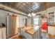 Cozy kitchen with stainless steel appliances, a butcher block island, decorative shelving and a vintage soda machine at 3405 W 8Th Street Rd, Anderson, IN 46011