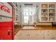 Bright kitchen features white cabinetry, wooden countertops, and a vintage Coca-Cola refrigerator at 3405 W 8Th Street Rd, Anderson, IN 46011