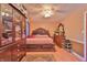 Spacious bedroom featuring beautiful wood furniture and a ceiling fan for added comfort at 3535 Ivory Way, Indianapolis, IN 46227