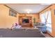 Cozy living room with comfortable seating, hardwood flooring and a decorative fireplace at 3535 Ivory Way, Indianapolis, IN 46227