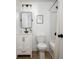 Bathroom featuring a shower over tub, modern fixtures and white vanity at 3864 Esquire Ct, Indianapolis, IN 46226