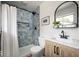 Bathroom featuring a blue tiled shower and light wood vanity at 3864 Esquire Ct, Indianapolis, IN 46226