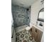 Bathroom with stylish tiles in the shower and on the floor and new vanity at 3864 Esquire Ct, Indianapolis, IN 46226