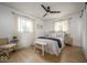 Bright bedroom with a ceiling fan, wood floors, natural light, and neutral décor at 3864 Esquire Ct, Indianapolis, IN 46226