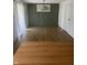Bright dining room with wainscoting, stylish chandelier, and natural light at 3864 Esquire Ct, Indianapolis, IN 46226
