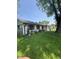 Charming one-story home with wood shutters, new windows and beautiful mature landscaping at 3864 Esquire Ct, Indianapolis, IN 46226