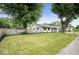 Charming home with well-kept lawn, white picket fence, and mature trees in a residential neighborhood at 3864 Esquire Ct, Indianapolis, IN 46226