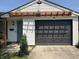 Exterior view featuring a garage and complementing pergola on a bright sunny day at 3864 Esquire Ct, Indianapolis, IN 46226