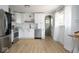 Bright kitchen featuring white cabinets, stainless steel appliances, and a large window at 3864 Esquire Ct, Indianapolis, IN 46226