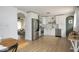 Bright kitchen featuring stainless steel appliances, white cabinets, and light wood flooring at 3864 Esquire Ct, Indianapolis, IN 46226