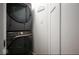 Convenient laundry area with stacked washer and dryer, and a handy laundry sign at 3864 Esquire Ct, Indianapolis, IN 46226