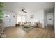 Bright living room featuring hardwood floors, neutral walls, and comfortable seating at 3864 Esquire Ct, Indianapolis, IN 46226