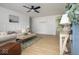 Cozy living room featuring wainscoting, modern decor, neutral color palette, and hardwood floors at 3864 Esquire Ct, Indianapolis, IN 46226