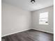 Cozy bedroom featuring a large window and hardwood flooring at 389 Vinewood N Dr, Brownsburg, IN 46112