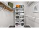 Organized walk-in closet with custom shelving, ample storage, and stylish decor at 389 Vinewood N Dr, Brownsburg, IN 46112