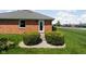 Charming brick home with manicured lawn and front door at 389 Vinewood N Dr, Brownsburg, IN 46112