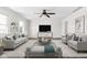 Stylish living room furnished with comfortable seating, contemporary décor, and a sleek entertainment center at 389 Vinewood N Dr, Brownsburg, IN 46112