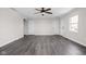 Spacious living room showcasing hardwood flooring and a neutral color palette, ready for personalization at 389 Vinewood N Dr, Brownsburg, IN 46112
