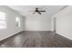 Bright and airy living room featuring modern flooring, fresh paint, and ample natural light through the windows at 389 Vinewood N Dr, Brownsburg, IN 46112