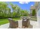 Back deck area with outdoor seating and a view of the landscaped yard at 3965 Andretti Dr, Zionsville, IN 46077