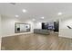 Spacious finished basement with wood floors, large mirror, and comfortable seating area at 3965 Andretti Dr, Zionsville, IN 46077