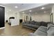 Open basement area featuring a comfortable sofa, workout machine, and neutral decor at 3965 Andretti Dr, Zionsville, IN 46077