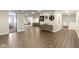 Open basement with plenty of natural light, neutral paint, and wood flooring at 3965 Andretti Dr, Zionsville, IN 46077