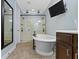 Luxurious bathroom featuring a soaking tub, walk-in shower, and modern fixtures at 3965 Andretti Dr, Zionsville, IN 46077