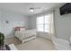 Cozy bedroom featuring a comfortable bed, natural light, and a soothing color palette at 3965 Andretti Dr, Zionsville, IN 46077