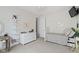 Charming bedroom features a large dresser, unique shelving, and a cozy bed with decorative pillows at 3965 Andretti Dr, Zionsville, IN 46077