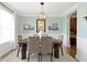 Elegant dining room with a modern chandelier, stylish decor, and an adjacent archway at 3965 Andretti Dr, Zionsville, IN 46077