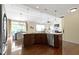 Large kitchen island with granite countertops, stainless steel appliances, and adjacent dining area at 3965 Andretti Dr, Zionsville, IN 46077