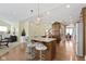 Kitchen island with granite countertops, barstool seating, and stainless steel appliances at 3965 Andretti Dr, Zionsville, IN 46077